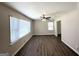 Bright living room featuring neutral walls, wood-look flooring, ceiling fan, and large picture windows at 2015 Boulderview Se Dr, Atlanta, GA 30316