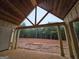 New construction features a spacious covered back porch with wood ceiling and pillars at 365 Spruill Bridge Road # 7 - Helmsley Park, Temple, GA 30179