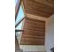 Stained wood ceiling with light wood beams and vertical siding on this new home at 365 Spruill Bridge Road # 7 - Helmsley Park, Temple, GA 30179