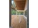 Covered patio featuring wooden beams and a stained wood ceiling overlooking the backyard at 365 Spruill Bridge Road # 7 - Helmsley Park, Temple, GA 30179