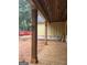 Covered porch with stained wood columns and ceiling of a new home build at 365 Spruill Bridge Road # 7 - Helmsley Park, Temple, GA 30179