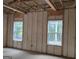 New construction shows room with spray foam insulation covering the walls and studs at 365 Spruill Bridge Road # 7 - Helmsley Park, Temple, GA 30179