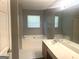 Bathroom featuring a bath tub with shower, toilet, and a vanity with mirror at 755 Kilkenny Cir, Lithonia, GA 30058