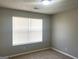 Cozy bedroom featuring neutral walls, carpet flooring, and a window with blinds at 755 Kilkenny Cir, Lithonia, GA 30058