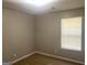 Bedroom with neutral paint, window with blinds, and carpet flooring at 755 Kilkenny Cir, Lithonia, GA 30058