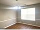 Dining room with wood floors, neutral walls, white trim and a chandelier at 755 Kilkenny Cir, Lithonia, GA 30058