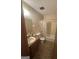 Cozy bathroom featuring a single sink vanity and tub at 8440 Winston Way, Jonesboro, GA 30236