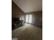 Bonus room with wood paneling, neutral carpet, and access to the exterior at 8440 Winston Way, Jonesboro, GA 30236