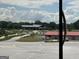 View of a large building and parking area across from a park at 8440 Winston Way, Jonesboro, GA 30236