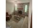 The living room features a brick fireplace, carpeted floors, and ample seating at 8440 Winston Way, Jonesboro, GA 30236