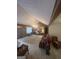 Spacious living room with vaulted ceilings, wood paneling and carpeted floors at 8440 Winston Way, Jonesboro, GA 30236