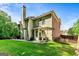 Spacious back exterior features a brick and siding design, and a patio for outdoor seating at 1605 Cascade Overlook, Peachtree City, GA 30269