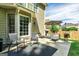 Relaxing patio area featuring comfortable seating, an umbrella, and outdoor decor at 1605 Cascade Overlook, Peachtree City, GA 30269