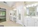 Bright bathroom features a tile floor, double sink vanity, and access to the bedroom at 1605 Cascade Overlook, Peachtree City, GA 30269