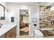 Bathroom boasts a glass shower, a modern toilet, stylish vanity, and view into the Bedroom at 1605 Cascade Overlook, Peachtree City, GA 30269