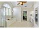 Bright bathroom with tile floor, large tub, shower, and double sink vanity at 1605 Cascade Overlook, Peachtree City, GA 30269