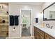 Bathroom featuring a stylish glass-enclosed shower, dark fixtures, and a view into the main bedroom at 1605 Cascade Overlook, Peachtree City, GA 30269