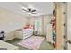 A bedroom with carpet, a ceiling fan, and a bed with shelving underneath at 1605 Cascade Overlook, Peachtree City, GA 30269