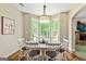 Charming breakfast nook with bright windows, a white table, and an inviting atmosphere at 1605 Cascade Overlook, Peachtree City, GA 30269