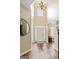 Inviting foyer with hardwood floors, chandelier, and soaring ceilings, creating a grand entrance at 1605 Cascade Overlook, Peachtree City, GA 30269