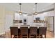 Spacious kitchen showcasing a center island with bar seating, stainless appliances, and white cabinetry at 1605 Cascade Overlook, Peachtree City, GA 30269