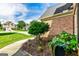 A charming walkway with lush landscaping, flowers, and a view of neighboring houses at 1605 Cascade Overlook, Peachtree City, GA 30269