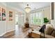 Cozy living room with hardwood floors, a comfortable sofa, and ample natural light at 1605 Cascade Overlook, Peachtree City, GA 30269