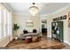 Stylish living room with hardwood floors, modern furnishings, and a decorative chandelier at 1605 Cascade Overlook, Peachtree City, GA 30269
