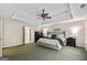 A spacious main bedroom features a trey ceiling, carpet, and large windows at 1605 Cascade Overlook, Peachtree City, GA 30269