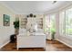 Bright home office with custom built-ins, a modern desk, and ample natural light at 1605 Cascade Overlook, Peachtree City, GA 30269