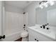 Modern bathroom featuring sleek white vanity and a clean, well-maintained shower-tub combination at 858 Pates Creek Rd, Stockbridge, GA 30281