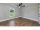 Bedroom with a ceiling fan and a window looking out to a green field at 858 Pates Creek Rd, Stockbridge, GA 30281