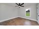 Bedroom featuring a window, ceiling fan and hardwood floors at 858 Pates Creek Rd, Stockbridge, GA 30281
