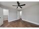 Bedroom boasting hardwood floors, a ceiling fan, and a large closet at 858 Pates Creek Rd, Stockbridge, GA 30281