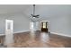 Spacious living room with hardwood floors, neutral walls, and a vaulted ceiling with ceiling fan at 858 Pates Creek Rd, Stockbridge, GA 30281