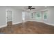 Large bedroom with a ceiling fan, wood floors and several large windows at 858 Pates Creek Rd, Stockbridge, GA 30281