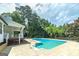 Pool area featuring an in-ground pool with a diving board and a nearby deck and backyard at 858 Pates Creek Rd, Stockbridge, GA 30281