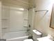 Bathroom featuring a tub-shower combination, commode, and vanity with white sink at 341 Pineland Sw Rd, Mableton, GA 30126