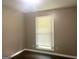 Simple bedroom with dark hardwood floors and a window providing natural light at 341 Pineland Sw Rd, Mableton, GA 30126