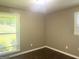 Bedroom with hardwood floors, neutral paint and two large windows at 341 Pineland Sw Rd, Mableton, GA 30126