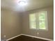 Bedroom with hardwood floors, neutral paint and a large window at 341 Pineland Sw Rd, Mableton, GA 30126