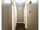 Hallway featuring hardwood floors, neutral paint and white doors at 341 Pineland Sw Rd, Mableton, GA 30126