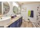 Bright bathroom featuring dual vessel sinks, granite counters, and stylish decor at 107 Trisha Ln, Grantville, GA 30220