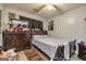 Cozy bedroom with ceiling fan, wood-look floors, and ample natural light at 107 Trisha Ln, Grantville, GA 30220
