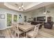 Dining area with views of the living room and backyard via the double doors to the yard at 107 Trisha Ln, Grantville, GA 30220
