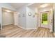 Inviting foyer with light gray walls, decorative mirrors, and luxury vinyl plank flooring at 107 Trisha Ln, Grantville, GA 30220