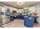 Modern kitchen with custom cabinets, stainless steel appliances, and luxury vinyl plank flooring at 107 Trisha Ln, Grantville, GA 30220