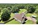 Aerial view of house with in-ground pool, lush lawn, and mature tree coverage at 250 Stallsworth Rd, Mcdonough, GA 30252