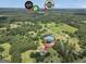 Aerial view of house, pool, and local amenities in a wooded neighborhood setting at 250 Stallsworth Rd, Mcdonough, GA 30252