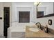 Clean and bright bathroom with a white tub and granite countertop vanity at 250 Stallsworth Rd, Mcdonough, GA 30252